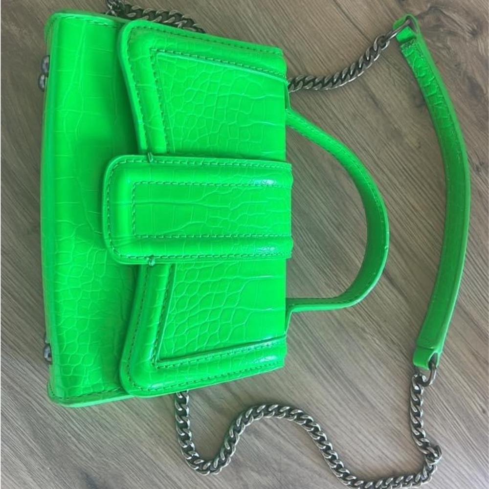 ZARA: Vibrant green purse.